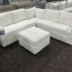 White Thick Corduroy Sectional And Ottoman 