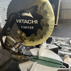 Hitachi 10” Saw, Extra Blade And All Accessory Pieces 