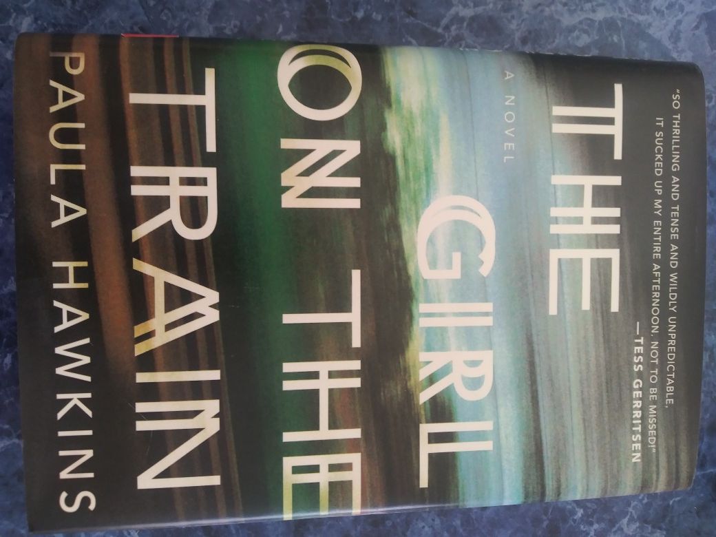 The Girl on the Train by Paula Hawkins novel. Hardcover book.