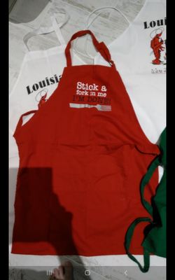 Brand new red apron. Never used. "Stick a fork in me I'm done".