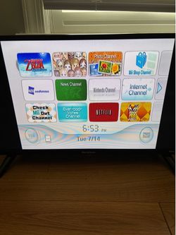 Nintendo Wii with controller and nunchuck, plus sensor bar