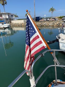 Beautiful vintage wooden flag pole with American Flag