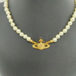 Brand new single-strand pearl necklace with golden yellow pendant