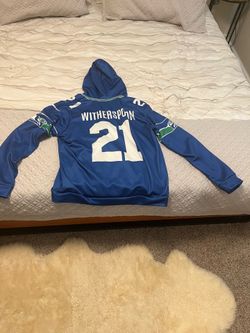 This is a Size LARGE blue Seattle Seahawks Devon Witherspoon #21 jersey-style hoodie
