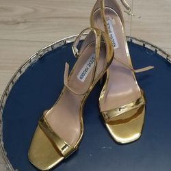 Gold Steve Madden High Heels.