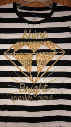 Kid’s size XL (14-16) black and white striped shirt with gold diamond graphics on the front