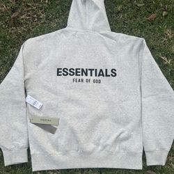 Fear of God Essentials Hoodie in 'Light Oatmeal' colorway. 