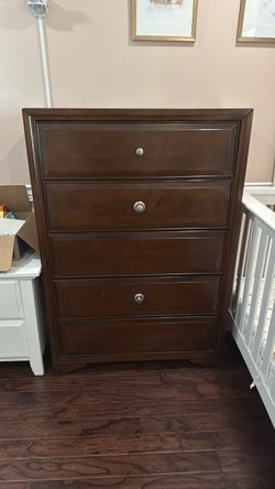 Brown wood five drawer dresser