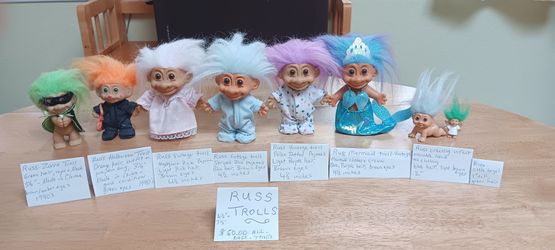 Seven Russ brand trolls, including 1 little Angel.