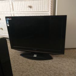 TV Sharp 32" Built In DVD Player.