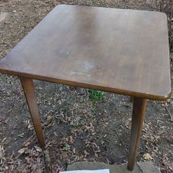 Square wooden table with rounded corners