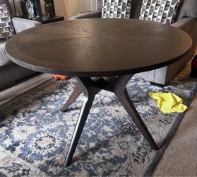 Circular dining table