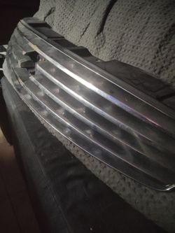 Nissan OEM Part # 62070-AM800 Front Grille Assembly