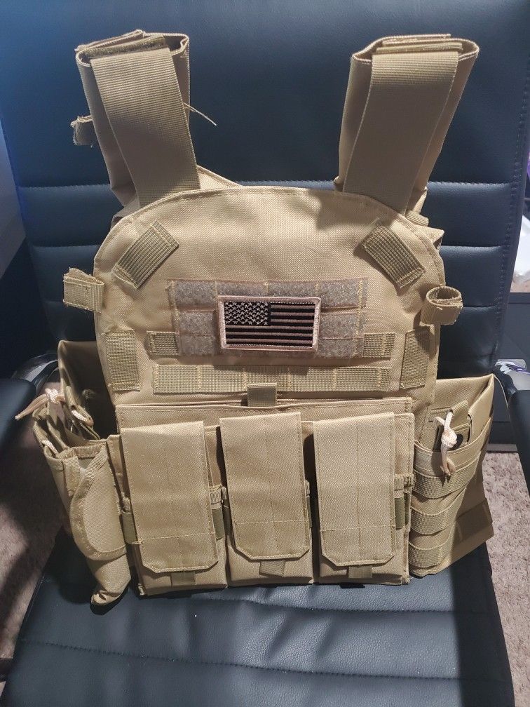 Brand New Tactical Vest With Tons Of Excessories And Can Hold Front and Back Plates ' NO Plates Included