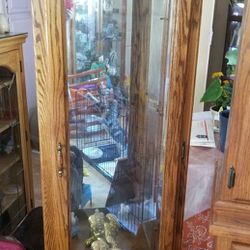 Curio Display Cabinet, with Crow Feets and Includes Three (3) Glass Shelves, Solid Oak Wood, Color Mahogany Brown with Light Fixture, Great Condition.