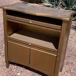 Modern credenza or sideboard featuring a gold finish and unique storage compartments and slide out drawers. Has some wear but is very solid.  This mea