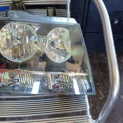 Chevy Tahoe. Passenger side Head light.