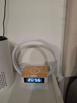 Bedside lamp with alarm clock and wireless charging