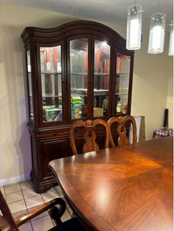 Dining table with chairs and china cabinet