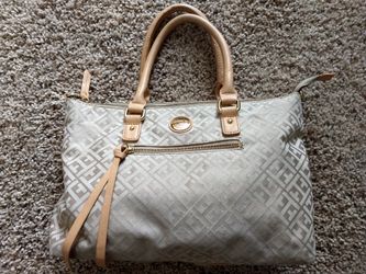 Unused, perfect Tommy Hilfiger Purse!!!zipper front and top. Genuine leather handle and tassles Tommy Hilfiger!! not a fake. I just don't use it!
