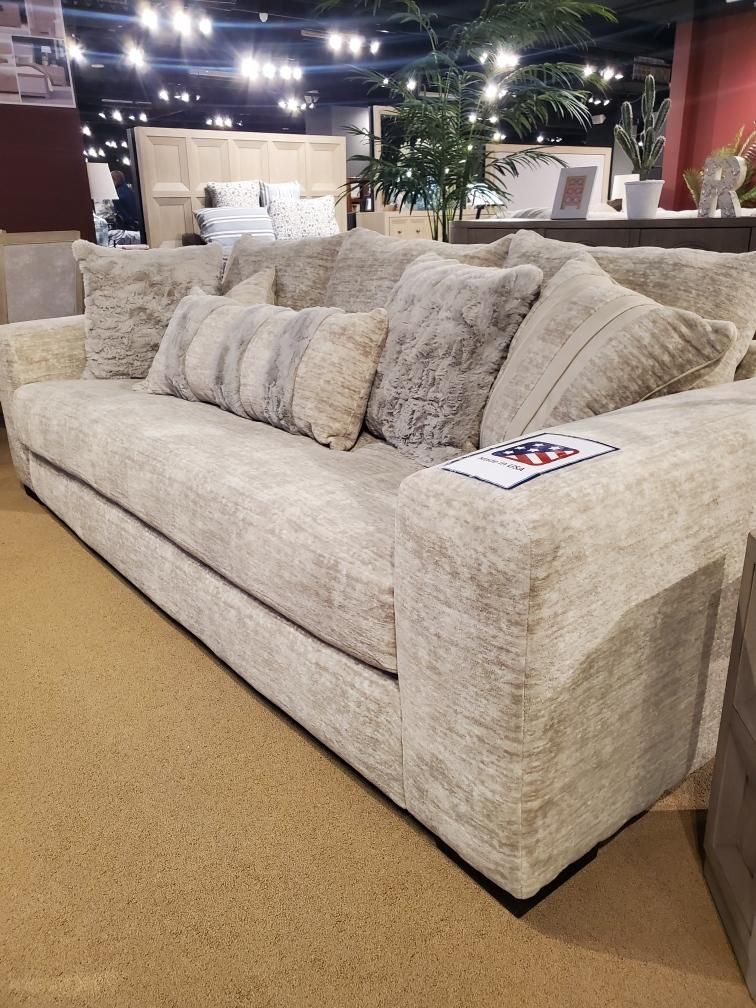 Luxurious Beige Fabric Sofa With Elegant Accent Pillows