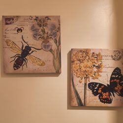 A Pair Of 12x12 Inches Wall Decor With Matching Bag