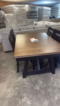 Brand new table and four chairs for 999