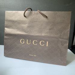 Brown Big Paper Gucci Bag. 