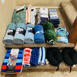 Brand new blankets, dish towel sets, and beach towels. Beach towels and travel pillows on the step are $5 each and everything else is $10 each. Or all