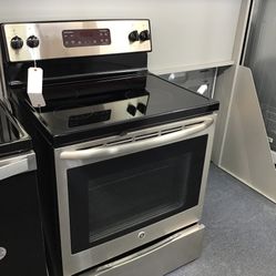 GE 4 Burner Glass Top Stainless Steel Range. 1 year Warranty 