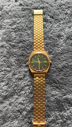 Nixon the time teller green dial.