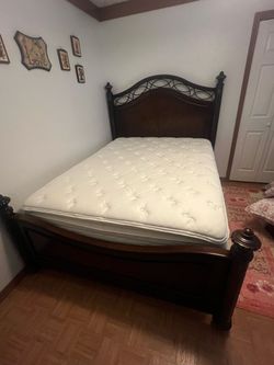 Queen bed frame with mattress and box spring