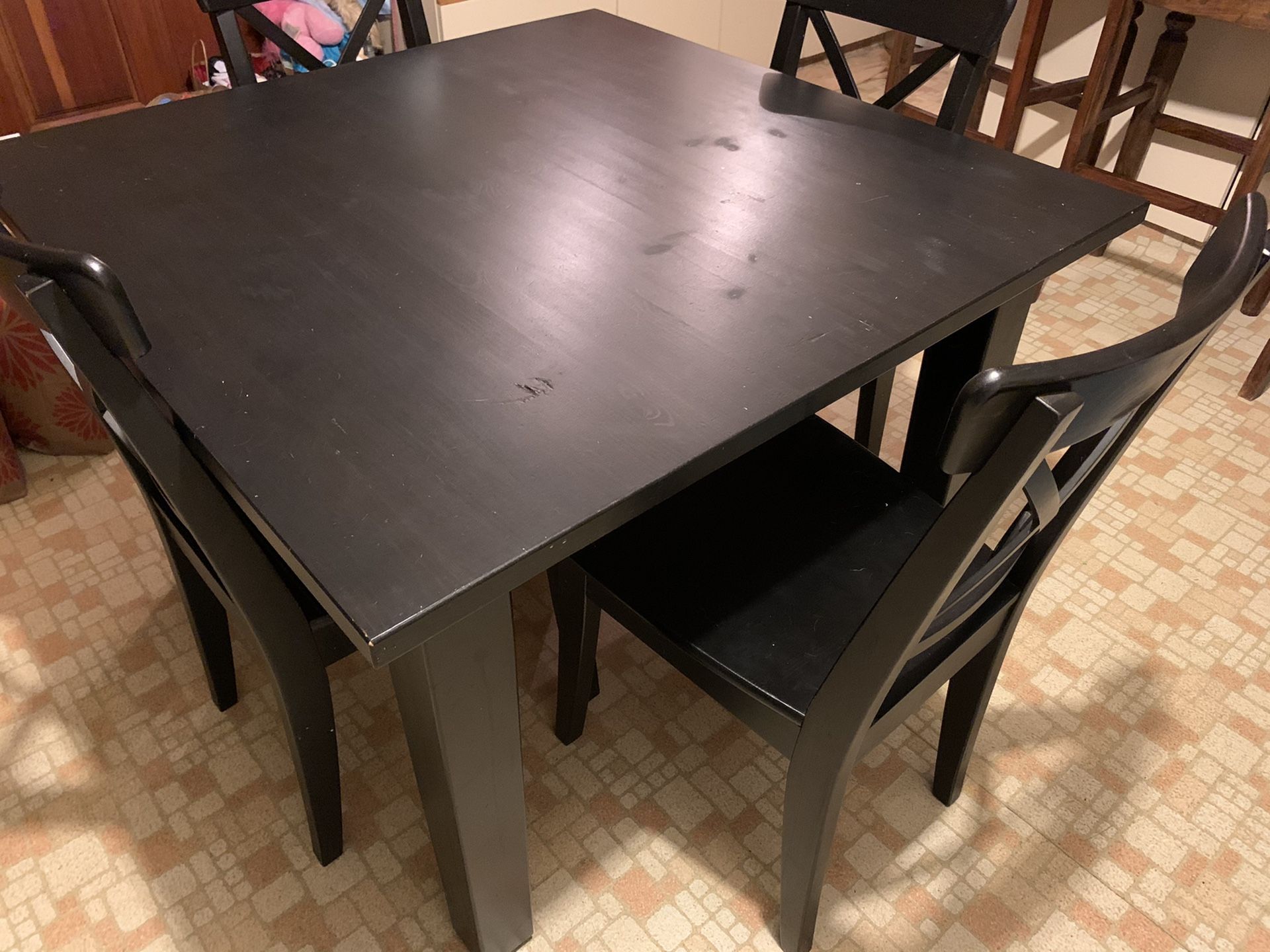 Dark brown dining room table and 4 chairs