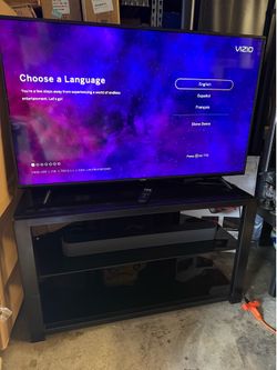 Older heavy duty glass metal tv stand