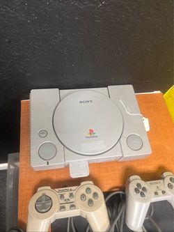 Sony PlayStation, two controllers, memory card  (no power cable)