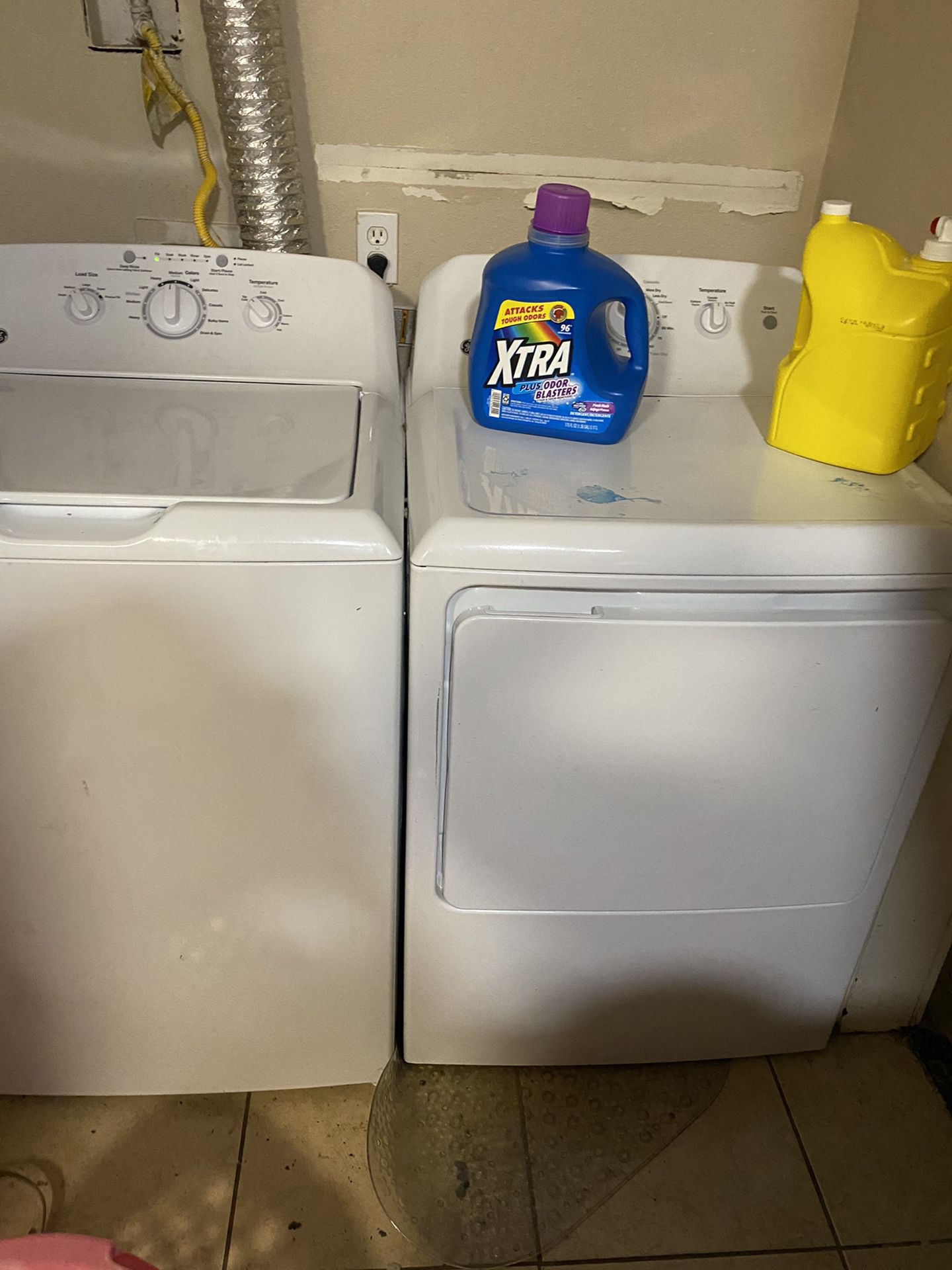 Washer and dryer still connected to show that it works and refrigerator