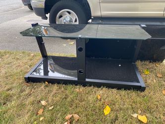 Black Heavy Glass TV Stand at Yard Sale Today