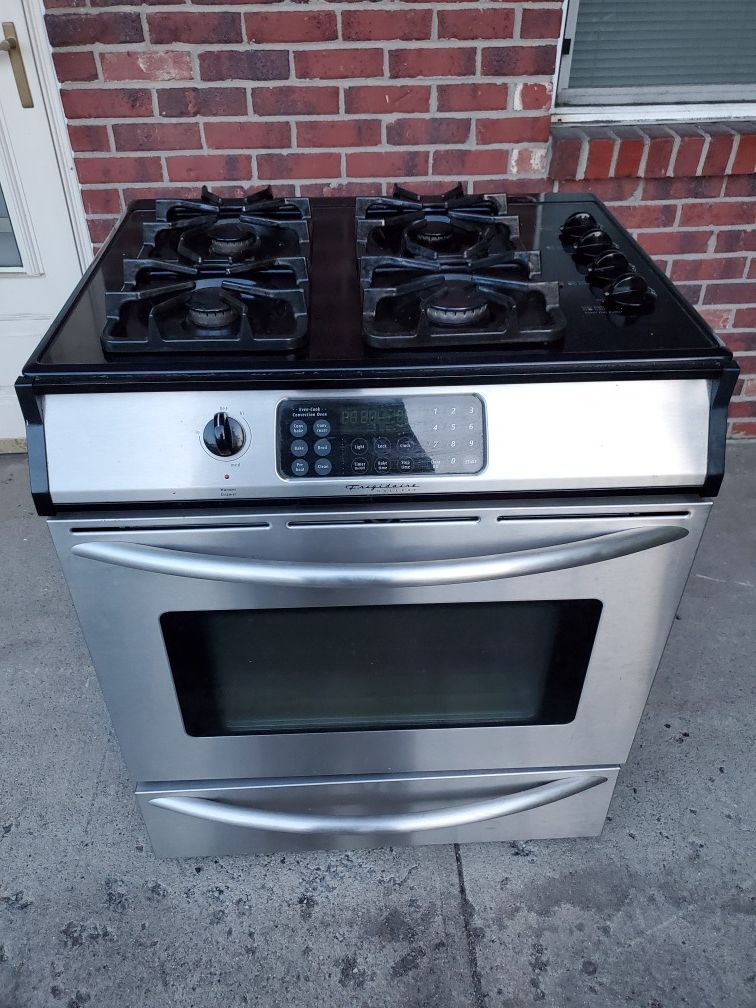 Frigidaire gas and 220 electric stainless steel stove good working conditions