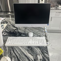 HP desktop computer with keyboard, mouse, and charger 