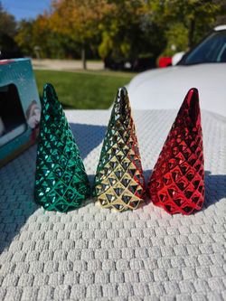 Three small shelf decor trees