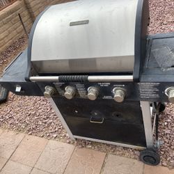 Lightly used Brinkmann 4 burner gas grill with additional side burner    