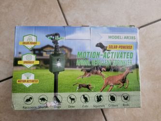Solar powered motion activated animal repellent sprinkler