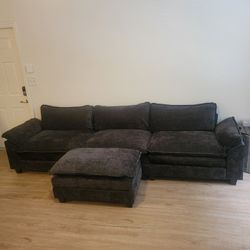 Black Couch with floating ottoman 