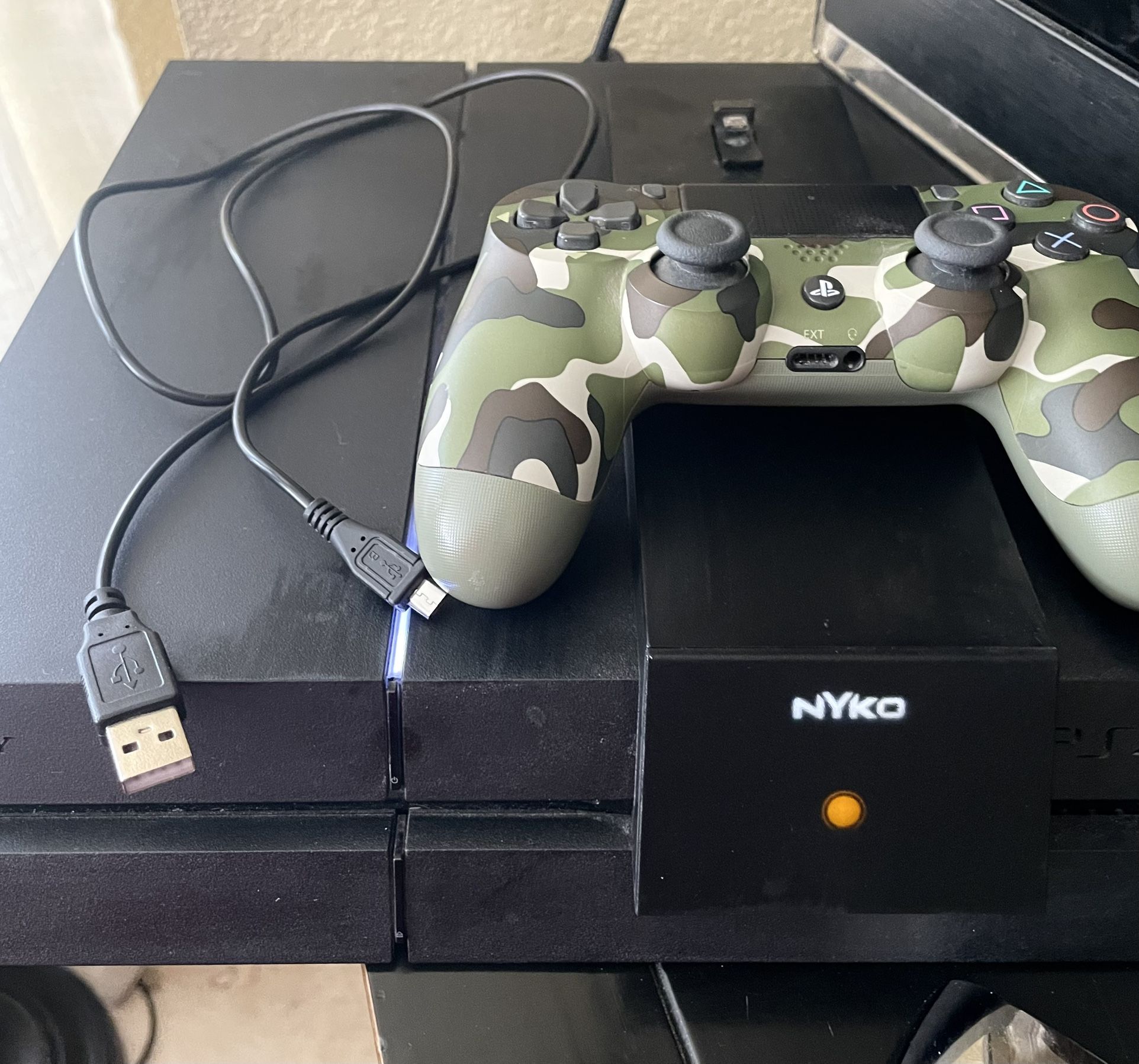 PlayStation 4 Console, A DualShock 4 Controller, And A Nyko Charging Base. PRICE IS FIRM