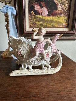Porcelain Cherub Sleigh Figurine