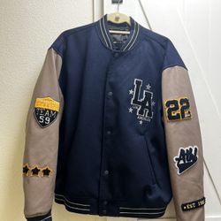 ASOS DESIGN oversized varsity bomber jacket in navy with mushroom faux leather