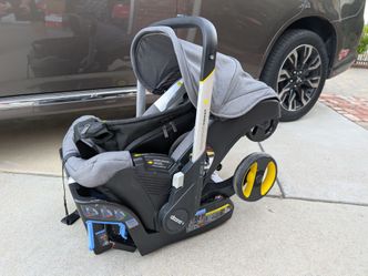 Doona Infant Car Seat Stroller, base, and Clip-On Hand Bag