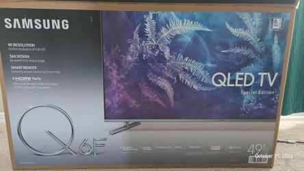 Samsung 49-Inch 4K Smart QLED TV for sale.