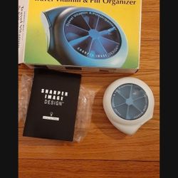 SHARPER IMAGE TRAVEL VITAMIN AND PILL ORGANIZER WITH CLOCK.