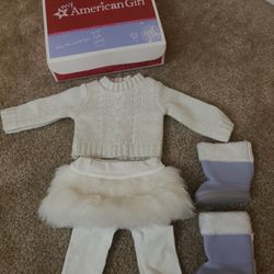 American girl soft as snow outfit in box.  Includes sweater, leggings, boots and fur skirt.  Great condition.   